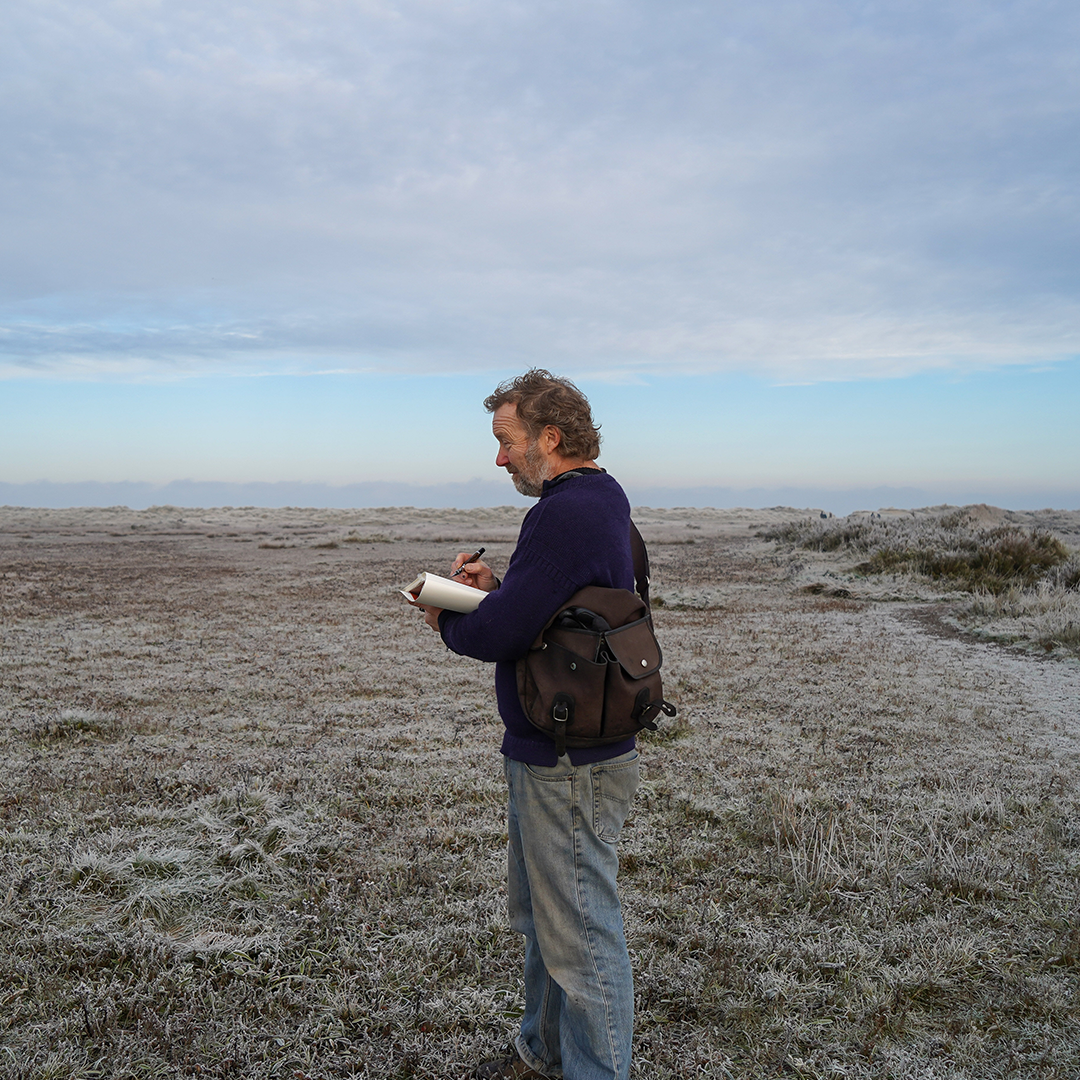 Harry Cory Wright sketching elements of the landscape at Titchwell Beach.